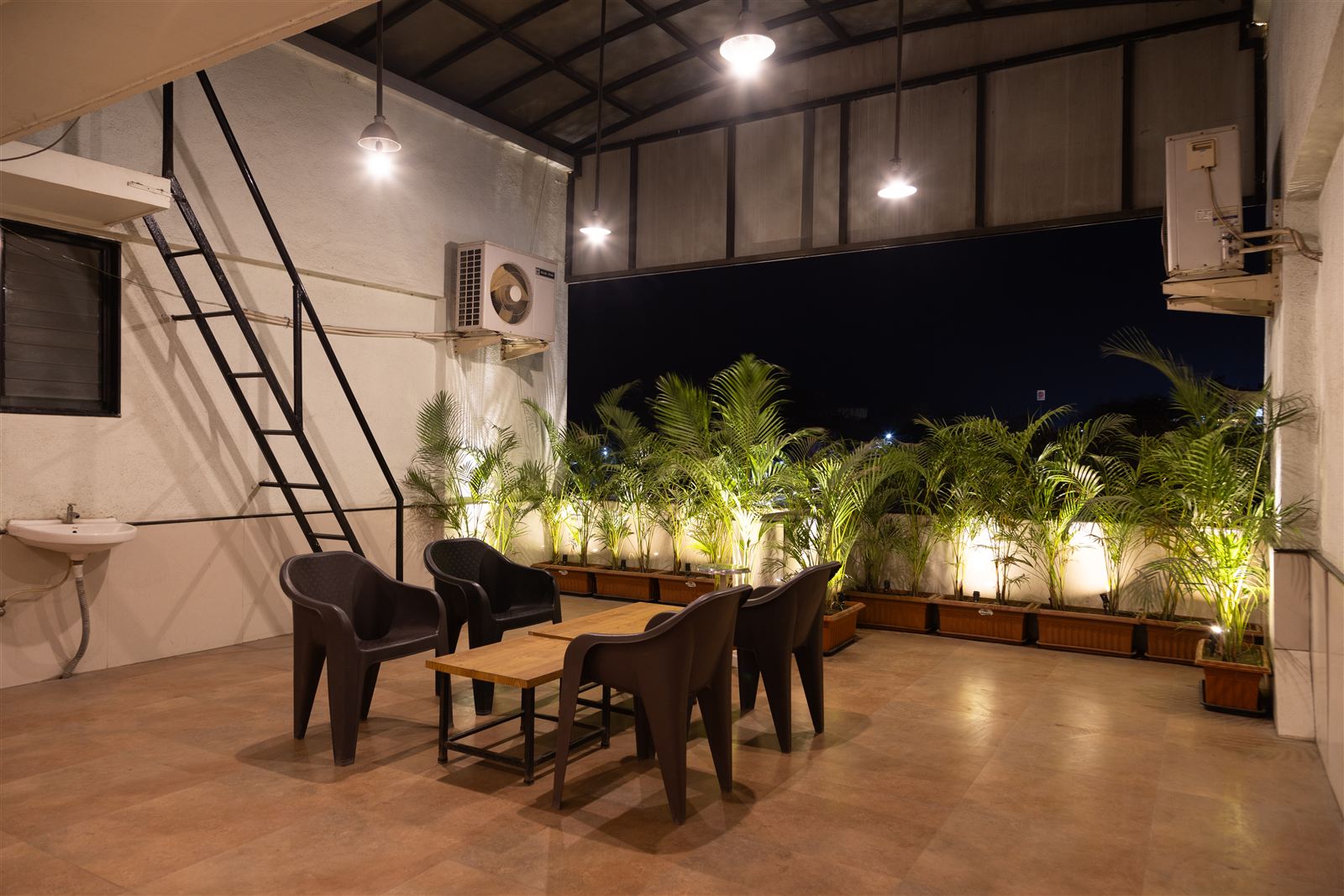 Rooftop balcony sit-out in the evening