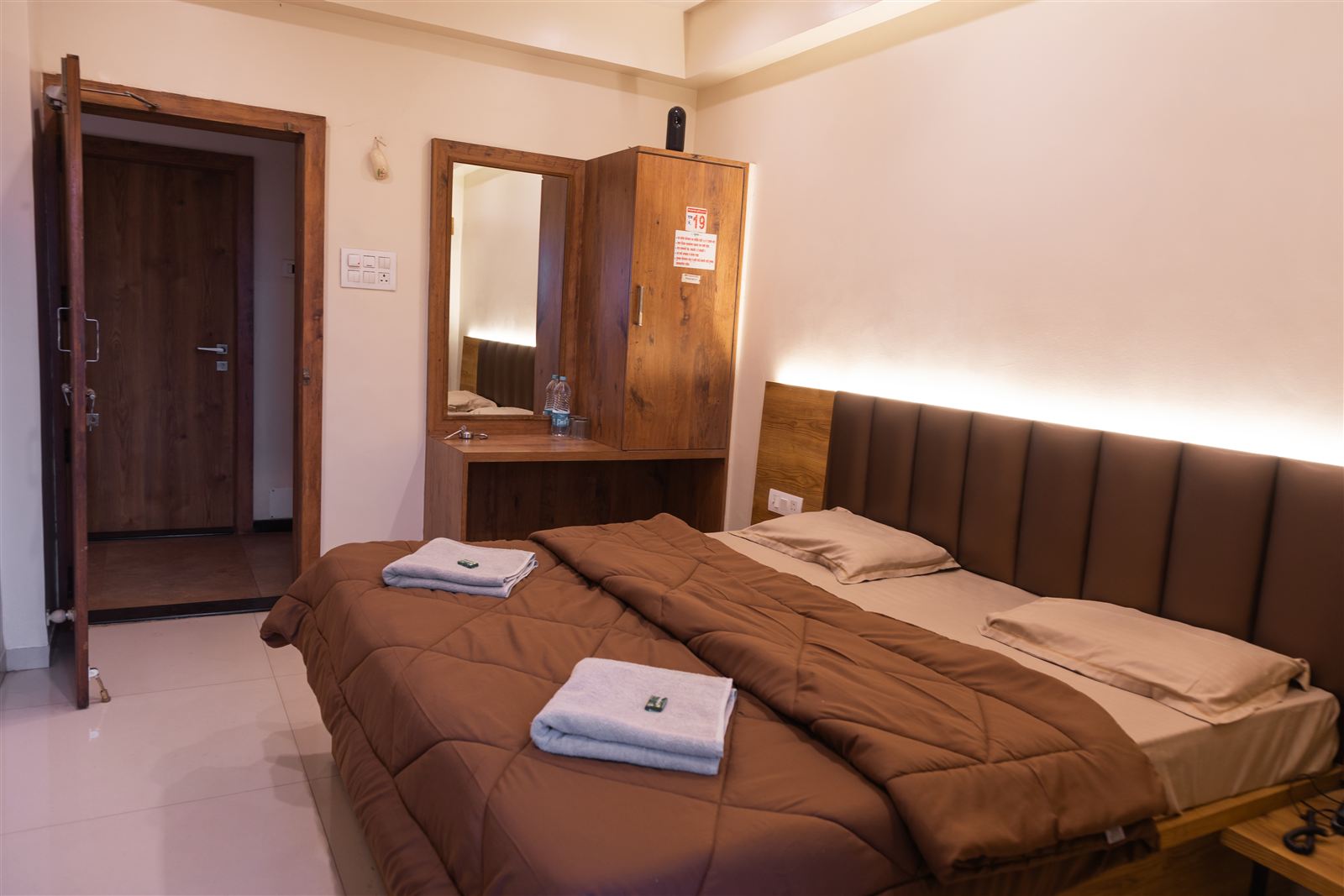 Deluxe room with double bed and warm cove lighting