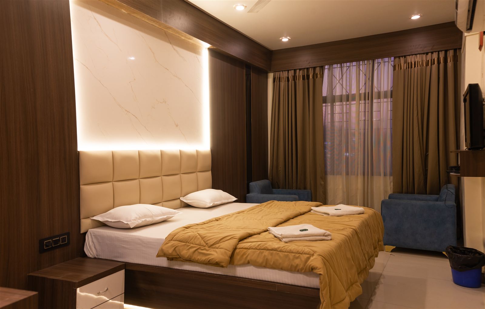 Premium room with backlit headboard and sofa seating